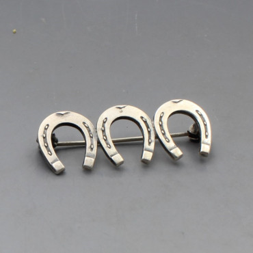 NE From Silver Triple Horseshoe Brooch