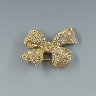 Clear Crystal and Gold Tone Bow Brooch