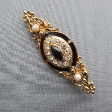 Black enamel diamante crystal gold tone brooch