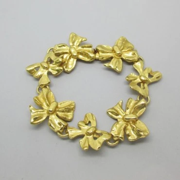 Yves Saint Laurent Gold Bow Design Bracelet