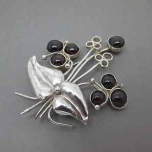 Vera Dorothy Corstorphine Silver and Garnet Brooch