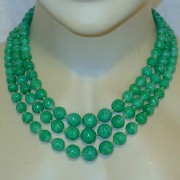 Triple strand green bead necklace